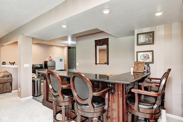 4297 W Division Rd, Crawfordsville, IN 47933 - indoor wet bar featuring freestanding refrigerator, recessed lighting, and light carpet
