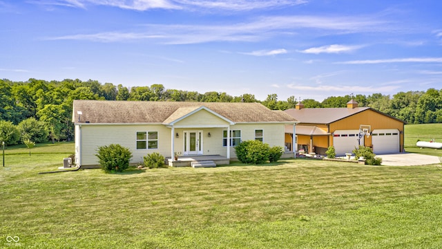 4297 W Division Rd, Crawfordsville, IN 47933 - ranch-style house with a front yard, concrete driveway, a chimney, and a garage