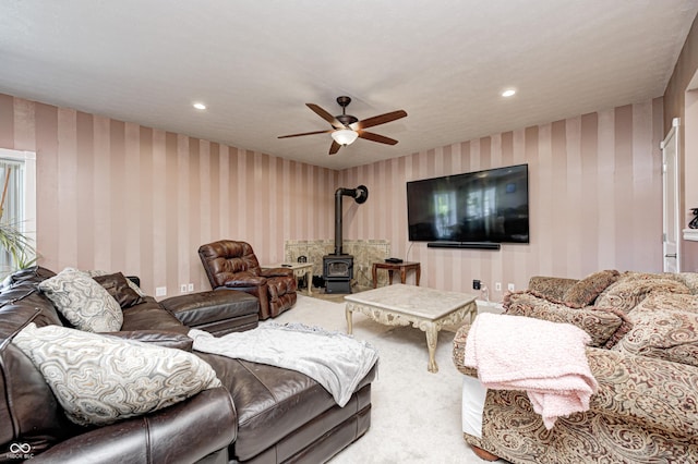 4297 W Division Rd, Crawfordsville, IN 47933 - carpeted living room featuring wallpapered walls, a wood stove, a ceiling fan, and recessed lighting
