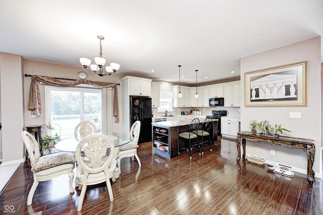 4297 W Division Rd, Crawfordsville, IN 47933 - dining area with a chandelier, dark wood-style floors, plenty of natural light, and recessed lighting