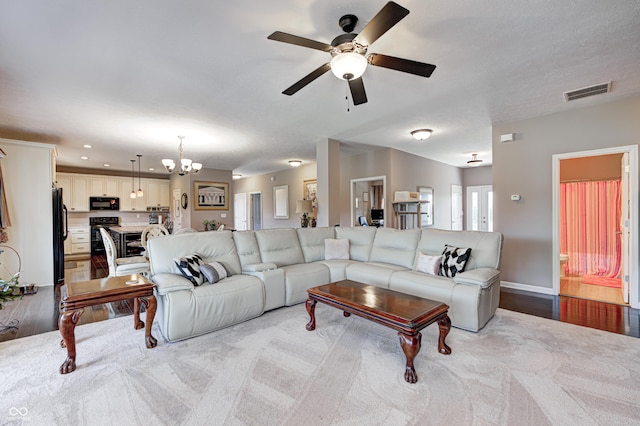 4297 W Division Rd, Crawfordsville, IN 47933 - living area with ceiling fan, a chandelier, wood finished floors, and recessed lighting