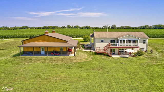 4297 W Division Rd, Crawfordsville, IN 47933 - back of property featuring agricultural plots, a patio area, and a view of countryside