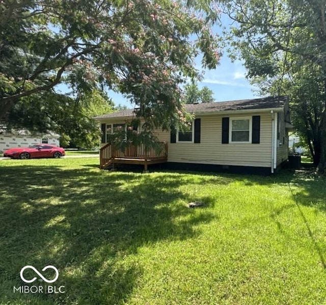 95 Rural St, Austin, IN 47102 - back of house with a yard and a wooden deck