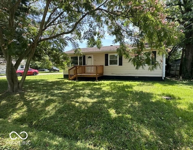 95 Rural St, Austin, IN 47102 - rear view of property featuring a deck and a lawn