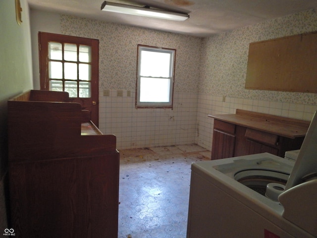 3926 S County Road 550 W, Coatesville, IN 46121 - washroom featuring tile patterned floors, wainscoting, washer / dryer, wallpapered walls, and tile walls