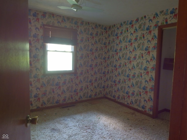 3926 S County Road 550 W, Coatesville, IN 46121 - unfurnished room with a ceiling fan, wallpapered walls, and carpet floors