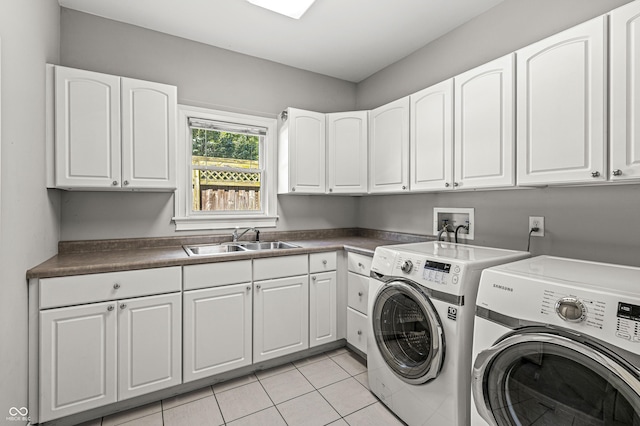 4920 Central Ave, Indianapolis, IN 46205 - laundry room with separate washer and dryer, cabinet space, and light tile patterned floors