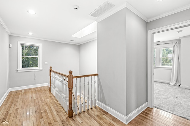 4920 Central Ave, Indianapolis, IN 46205 - corridor featuring light wood-type flooring, an upstairs landing, a skylight, ornamental molding, and recessed lighting