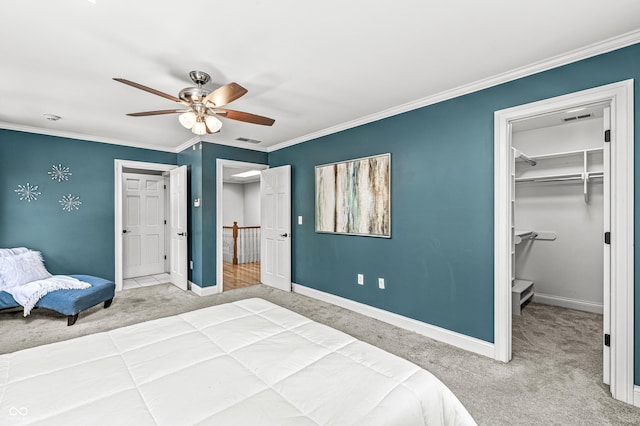 4920 Central Ave, Indianapolis, IN 46205 - bedroom with carpet, a walk in closet, crown molding, a ceiling fan, and a closet