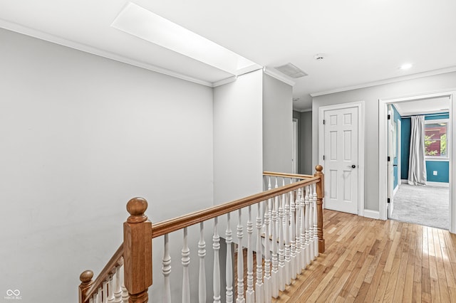 4920 Central Ave, Indianapolis, IN 46205 - hallway featuring an upstairs landing, light wood-type flooring, crown molding, and recessed lighting