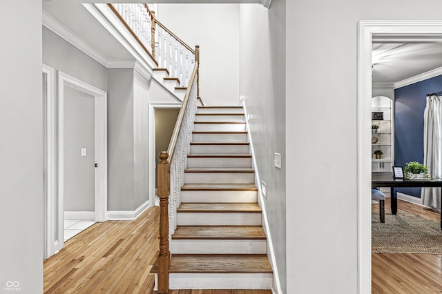 4920 Central Ave, Indianapolis, IN 46205 - stairs with crown molding and wood-type flooring
