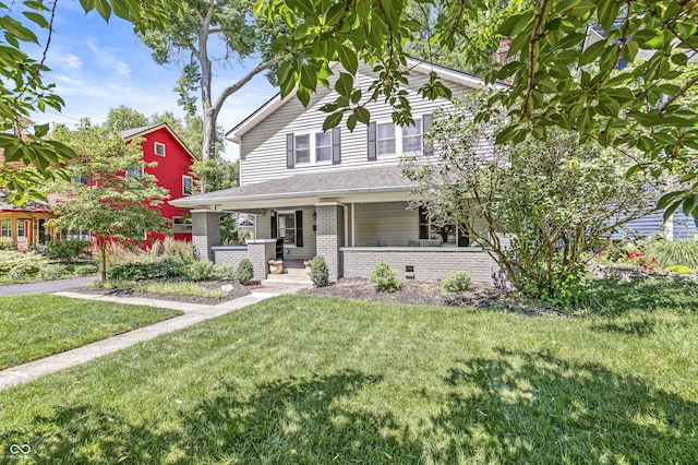4920 Central Ave, Indianapolis, IN 46205 - view of front of property with a porch, brick siding, and a front lawn