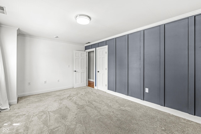 4920 Central Ave, Indianapolis, IN 46205 - unfurnished bedroom featuring carpet flooring and ornamental molding