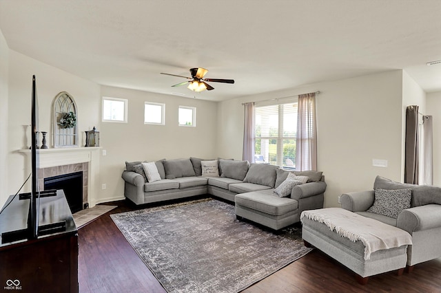 13525 Forest Glade Dr, Fishers, IN 46037 - living area with a ceiling fan, dark wood-style flooring, and a tile fireplace