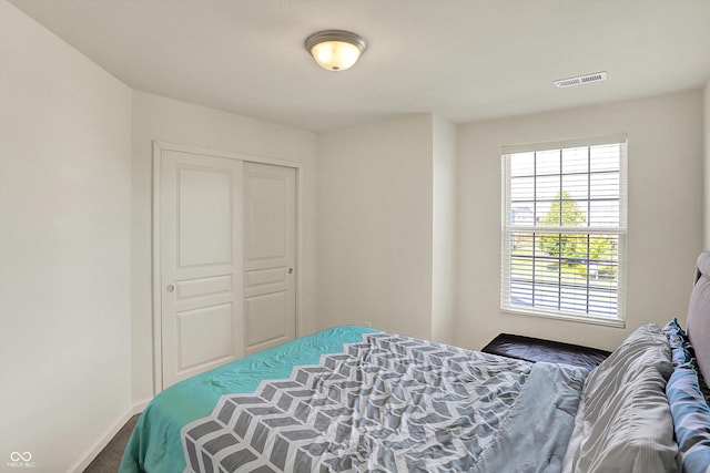 13525 Forest Glade Dr, Fishers, IN 46037 - bedroom with multiple windows, a closet, and carpet floors