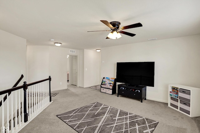 13525 Forest Glade Dr, Fishers, IN 46037 - living area with carpet floors, an upstairs landing, and ceiling fan