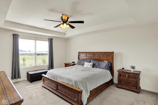 13525 Forest Glade Dr, Fishers, IN 46037 - bedroom with a raised ceiling, light colored carpet, and a ceiling fan