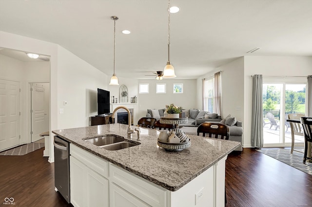 13525 Forest Glade Dr, Fishers, IN 46037 - kitchen with dark wood-style floors, open floor plan, a ceiling fan, pendant lighting, and light stone counters