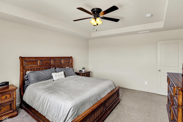 13525 Forest Glade Dr, Fishers, IN 46037 - bedroom with light carpet, a raised ceiling, and ceiling fan