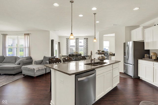 13525 Forest Glade Dr, Fishers, IN 46037 - kitchen with stainless steel appliances, open floor plan, healthy amount of natural light, a breakfast bar, and recessed lighting