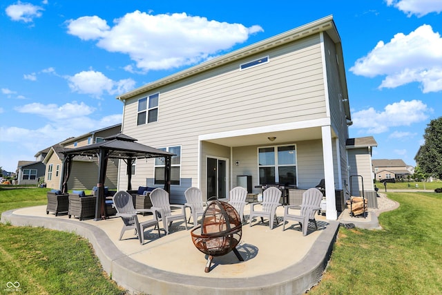 13525 Forest Glade Dr, Fishers, IN 46037 - back of house featuring an outdoor living space with a fire pit, a patio area, a gazebo, and a lawn