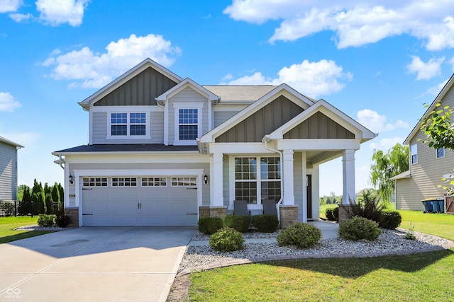 13525 Forest Glade Dr, Fishers, IN 46037 - craftsman inspired home featuring board and batten siding, concrete driveway, a garage, stone siding, and a front lawn