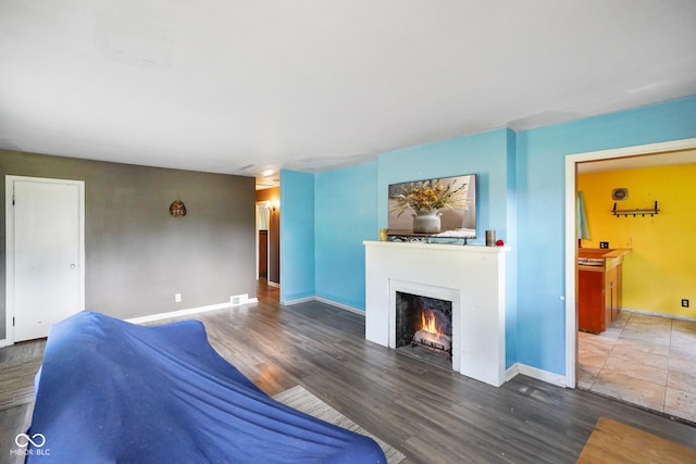4 Kentwood Dr, Greencastle, IN 46135 - living room featuring a lit fireplace and wood finished floors