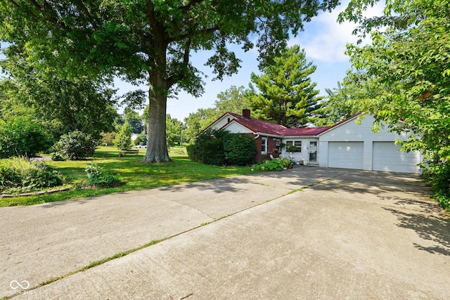 4 Kentwood Dr, Greencastle, IN 46135 - ranch-style house with an attached garage, concrete driveway, and a front yard