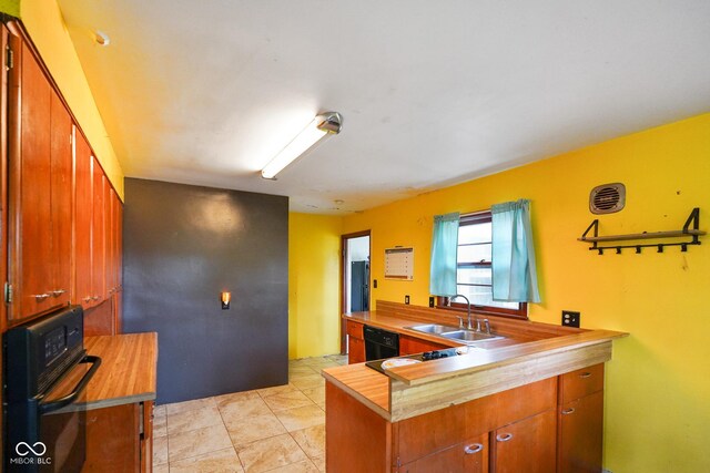 4 Kentwood Dr, Greencastle, IN 46135 - kitchen with black appliances, wooden counters, brown cabinetry, and a peninsula