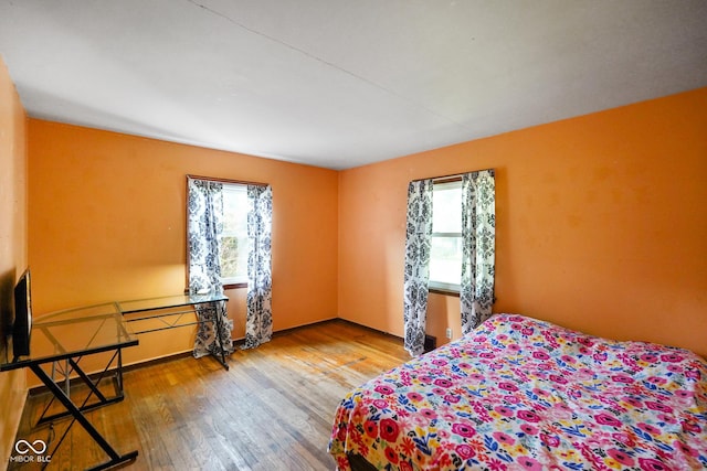 4 Kentwood Dr, Greencastle, IN 46135 - bedroom featuring multiple windows and wood finished floors