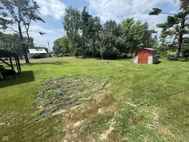 8394 E Mulberry St, Columbus, IN 47203 - view of grassy yard featuring a storage shed