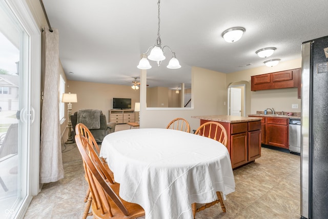 546 Greenwood Trace Dr, Whiteland, IN 46184 - dining room featuring arched walkways, a ceiling fan, and a chandelier