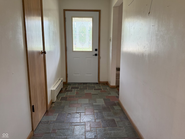 2212 Hanover Dr, Indianapolis, IN 46227 - entryway with a baseboard heating unit and stone tile flooring