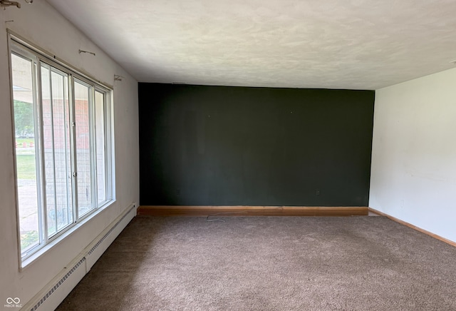 2212 Hanover Dr, Indianapolis, IN 46227 - spare room featuring a baseboard radiator and carpet flooring