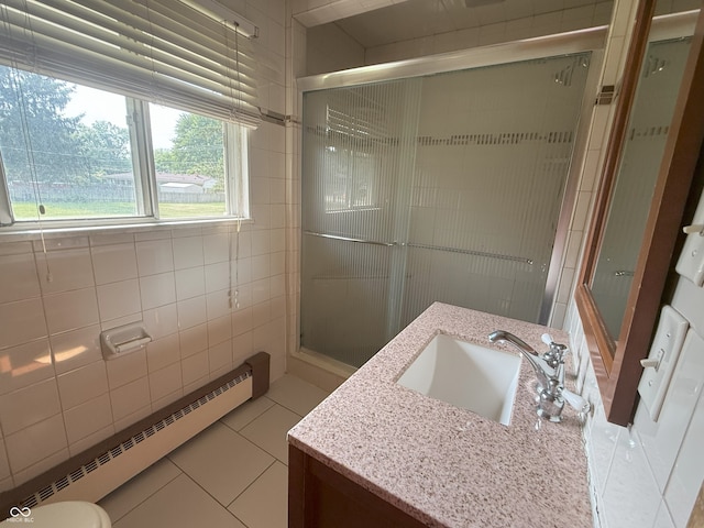 2212 Hanover Dr, Indianapolis, IN 46227 - bathroom with a baseboard heating unit, vanity, tile patterned flooring, and a shower stall