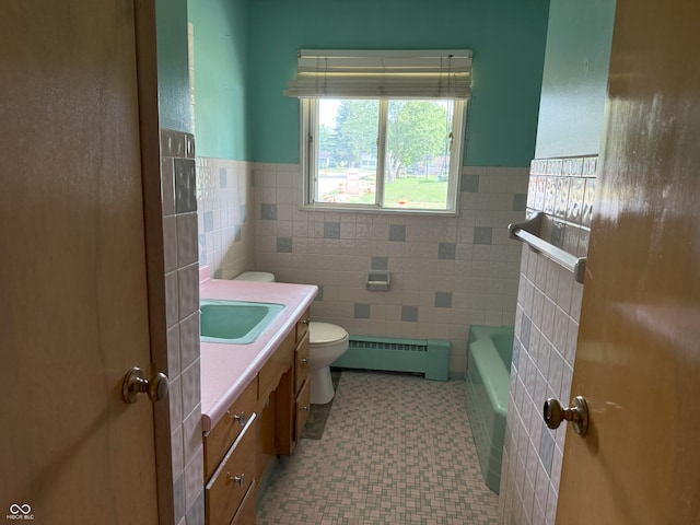 2212 Hanover Dr, Indianapolis, IN 46227 - full bathroom with vanity, a bathtub, tile patterned floors, wainscoting, and tile walls