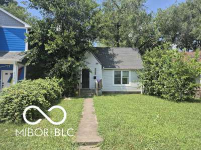 2140 Sugar Grove Ave, Indianapolis, IN 46202 - view of property hidden behind natural elements featuring a front yard