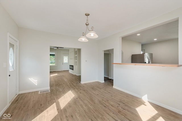 312 E Columbia St, Attica, IN 47918 - spare room featuring light wood-style floors, a ceiling fan, and recessed lighting