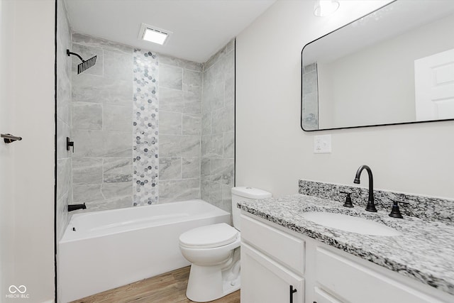 312 E Columbia St, Attica, IN 47918 - bathroom featuring wood finished floors, vanity, and shower / bathtub combination