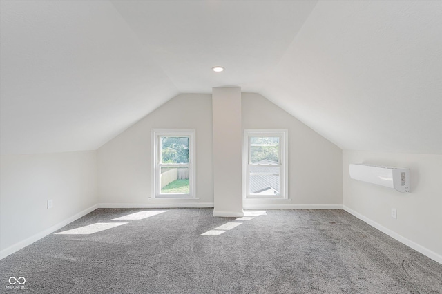 312 E Columbia St, Attica, IN 47918 - bonus room featuring carpet flooring, lofted ceiling, and an AC wall unit