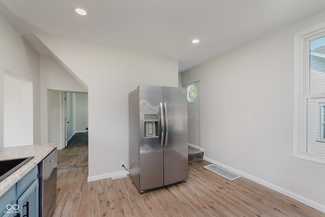 312 E Columbia St, Attica, IN 47918 - kitchen featuring stainless steel appliances, light wood-style flooring, light countertops, blue cabinetry, and recessed lighting