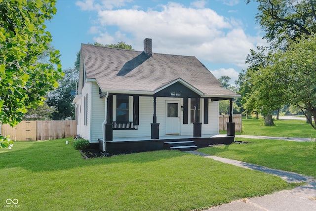 312 E Columbia St, Attica, IN 47918 - bungalow-style house featuring a chimney, covered porch, and a shingled roof