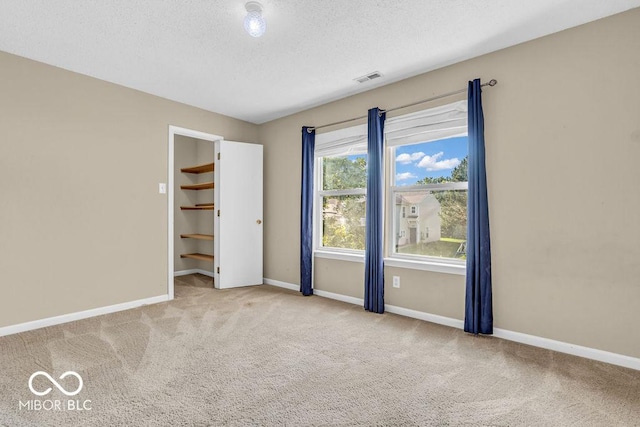 5971 Portman Pl, Plainfield, IN 46168 - carpeted empty room featuring a textured ceiling and baseboards