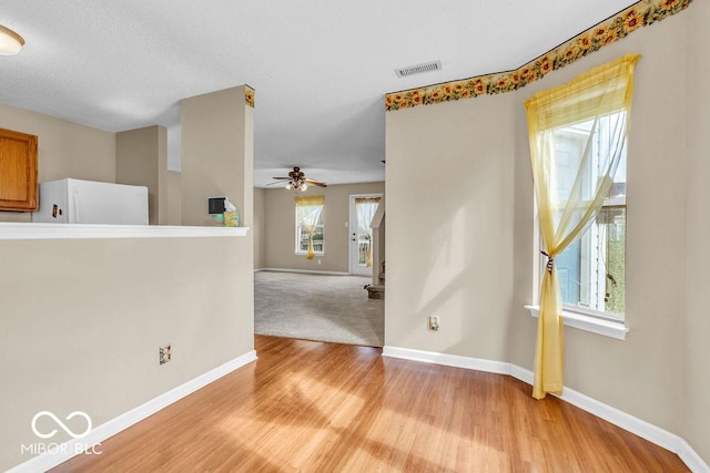 5971 Portman Pl, Plainfield, IN 46168 - unfurnished room featuring light wood-type flooring, ceiling fan, and stairs