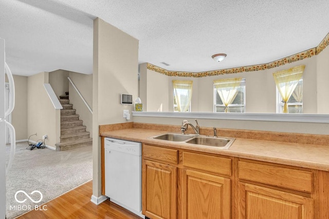 5971 Portman Pl, Plainfield, IN 46168 - kitchen featuring white appliances, light countertops, a textured ceiling, and light wood finished floors