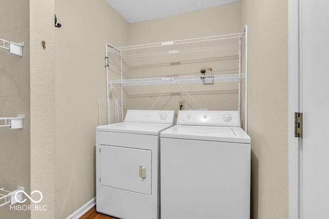 5971 Portman Pl, Plainfield, IN 46168 - laundry area with washer and dryer and wood finished floors