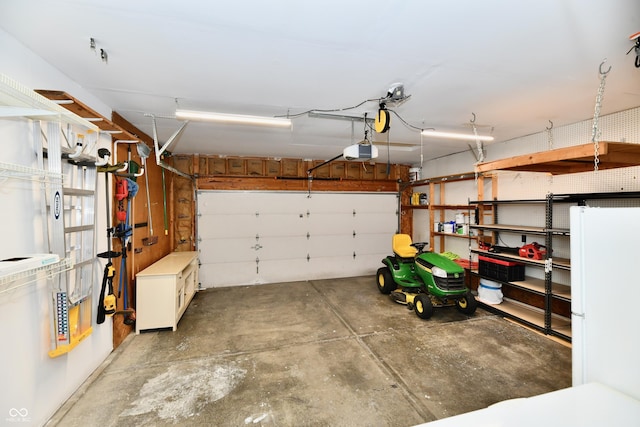 3675 Homestead Cir E, Plainfield, IN 46168 - garage with freestanding refrigerator and a garage door opener