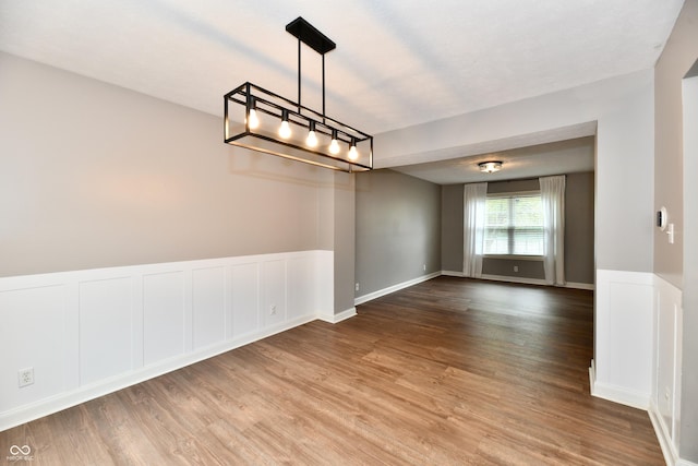 3675 Homestead Cir E, Plainfield, IN 46168 - spare room featuring wood finished floors and wainscoting