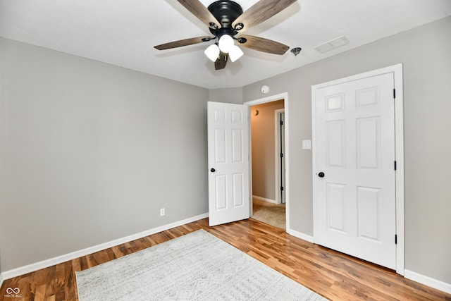 3675 Homestead Cir E, Plainfield, IN 46168 - unfurnished bedroom with light wood-style flooring and a ceiling fan