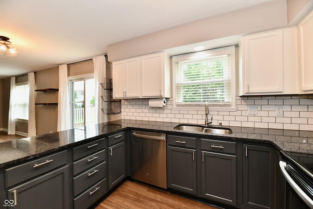 3675 Homestead Cir E, Plainfield, IN 46168 - kitchen with dishwasher, wood finished floors, white cabinets, and backsplash